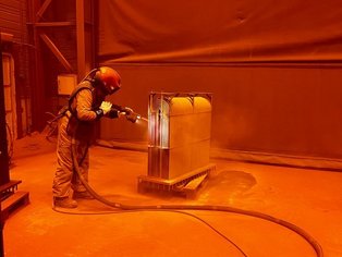 A Box Cooler during grit blasting to ISO 8501-1:2007 Sa3