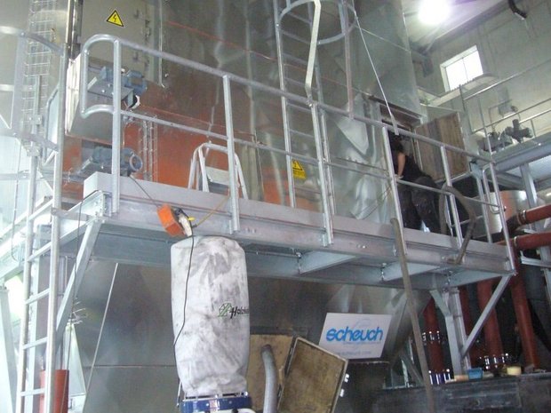 An electrostatic precipitator (ESP) enclosed for maintenance and cleaning work, including insulator cleaning with the SAEKAPHEN cleaning system.