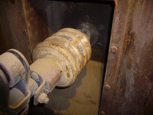 A high-voltage insulator installed in an Electrostatic Precipitator (ESP) before being cleaned with SÄKAPHEN-Cleaning System