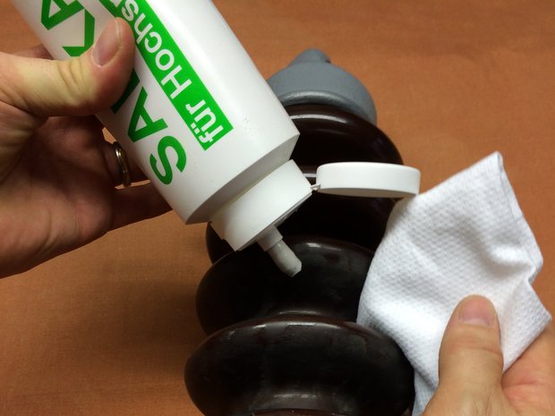 SAEKA-Cleaning Paste 80.750 beingapplied in order to clean, seal and protect insulators, preventing flash-overs and electrical short circuits