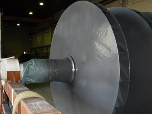 Three Impeller Wheels mounted on a shaft, coated with Si 57 E, during application of the coating