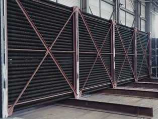 Economizer Tubes after assembly of the bundle,  coated with Si 17 N to protect them  against chemical attack and abrasion caused by ashes in the flue gas 