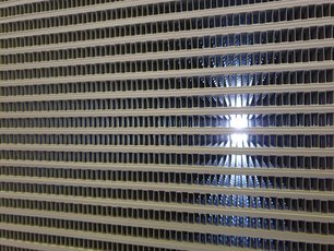 Finned Tube Heat Exchanger installed in heavy machinery, coated with Si 570 AR which offers enhanced protection against abrasio