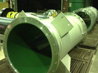 Column sections lined with Si 14 E on their way in to the oven for the final polymerization