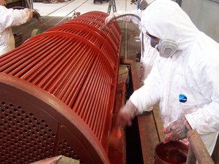 Shell side application of Si 14 EG baked phenolic on a tube bundle